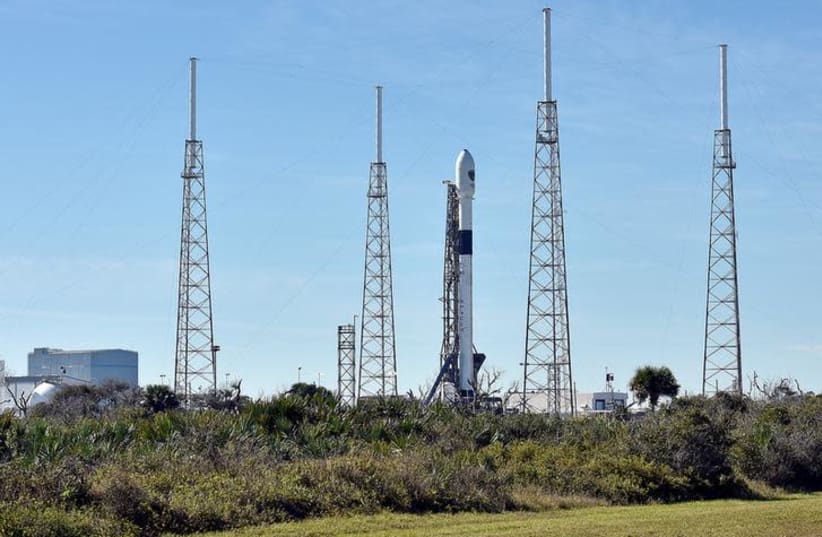 The SpaceX Falcon 9 rocket, scheduled to launch a U.S. Air Force navigation satellite, sits on Launch Complex 40 after the launch was postponed after an abort procedure was triggered by the onboard flight computer, at Cape Canaveral, Florida, U.S. (photo credit: REUTERS/STEVE NESIUS)