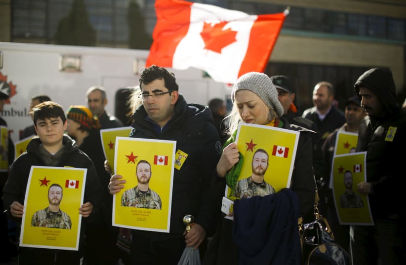 Mourners hold photos of John Gallagher, a Canadian volunteer fighter and former Canadian forces member who was killed fighting alongside Kurdish forces in Syria against the Islamic State, in Toronto, November 20, 2015 (photo credit: REUTERS)