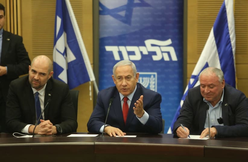 Prime Minister Benjamin Netanyahu and Likud members in December 24th, 2018 (photo credit: MARC ISRAEL SELLEM/THE JERUSALEM POST)