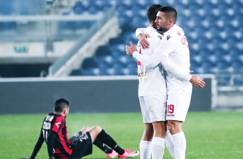 AFTER GOING down 1-0 to Hapoel Katamon, Hapoel Tel Aviv (in white) rallied back to claim a 2-1 road victory in State Cup action over the weekend (photo credit: DANNY MARON)