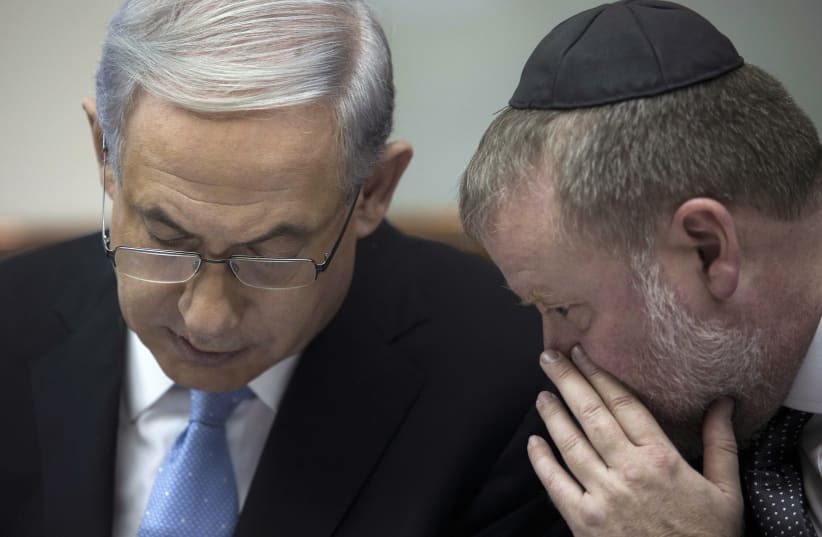 Israel's Prime Minister Benjamin Netanyahu listens to Avichai Mandelblit (photo credit: ABIR SULTAN/POOL/VIA REUTERS)