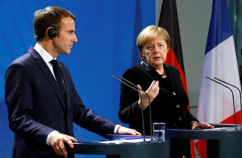 French President Emmanuel Macron and German Chancellor Angela Merkel speak to reporters ahead of their meeting in Berlin, Germany, November 18, 2018. (photo credit: REUTERS/FABRIZIO BENSCH)