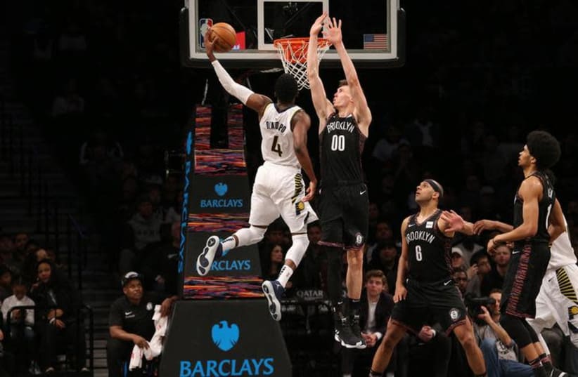 Indiana Pacers shooting guard Victor Oladipo (4) dunks against Brooklyn Nets small forward Rodions Kurucs (00) during the fourth quarter at Barclays Center, Brooklyn, NY, December 21st, 2018 (photo credit: BRAD PENNER/USA TODAY SPORTS VIA REUTERS)