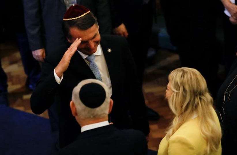 Brazil's President-elect Jair Bolsonaro salutes Israeli Prime Minister Benjamin Netanyahu in a synagogue in Rio de Janeiro, Brazil December 28, 2018. (photo credit: REUTERS)