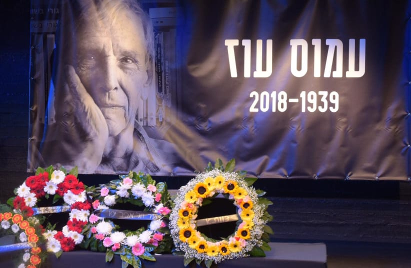 Wreaths are laid at a memorial service for Amos Oz in Tel Aviv, December 31st, 2018 (photo credit: AVSHALOM SASSONI/ MAARIV)