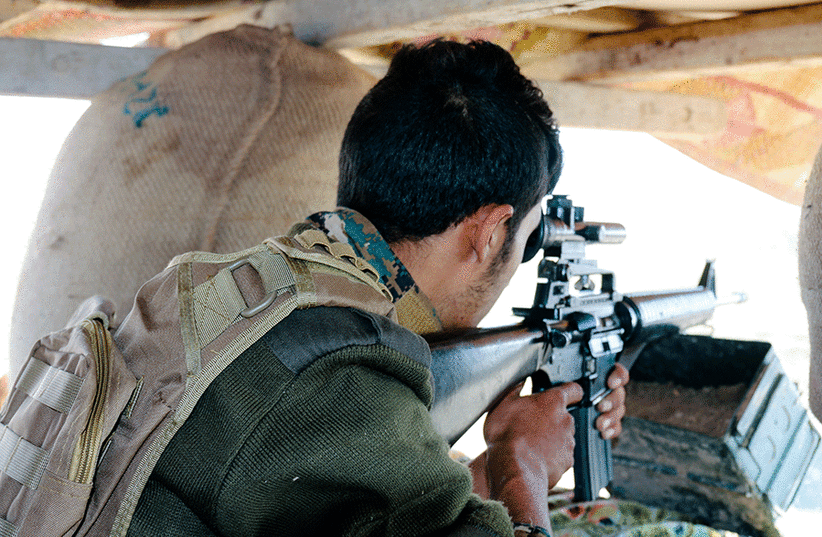 An SDF sniper (photo credit: THE MEDIA LINE)