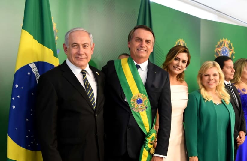 Prime Minister Benjamin Netanyahu with Brazilian President Jair Bolsonaro, his wife Michelle Bolsonaro, and the wife of the PM Sara Netanyahu   (photo credit: AVI OHAYON - GPO)