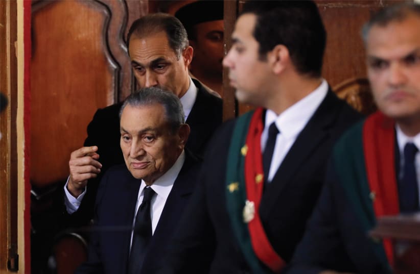 FORMER EGYPTIAN president Hosni Mubarak testifies during a court case accusing ousted Islamist president Mohamed Mursi of breaking out of prison in 2011, in Cairo on December 26. (photo credit: REUTERS)