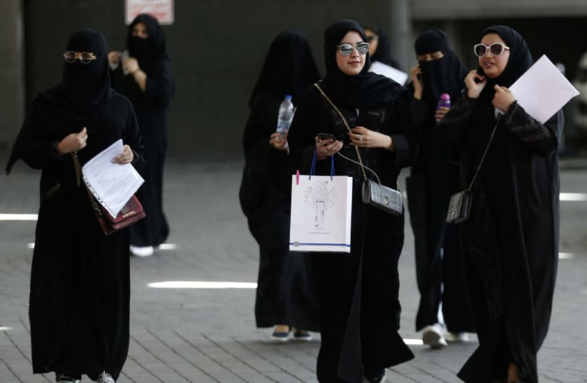 Saudi students walk at the exhibition to guide job seekers at Glowork Women's Career Fair in Riyadh, Saudi Arabia October 2, 2018 (photo credit: REUTERS/FAISAL AL NASSER)