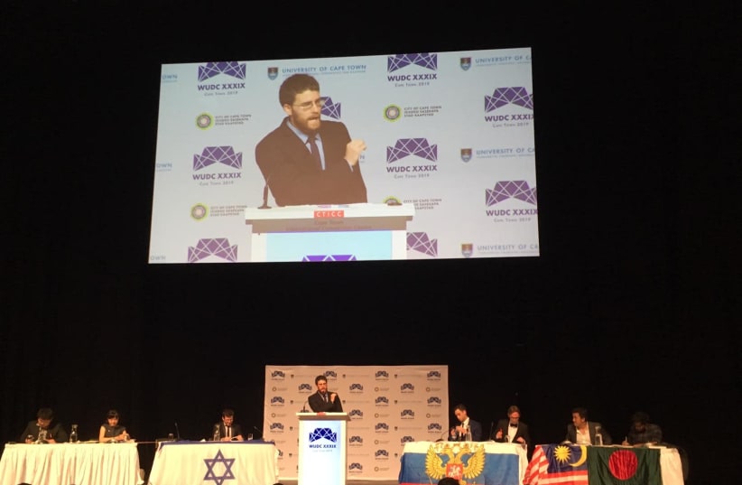 Israeli debate world championship Roy Shulmann makes a speech at the World Universities Debate Championship, 2019 (photo credit: DANA GREEN)