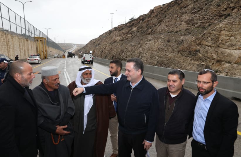 Israelis and Palestinians celebrate the opening of the road on Wednesday. Included in the photo is Transportation Minister Yisrael Katz and Binyamin Regional Council head Israel Ganz (photo credit: Courtesy)