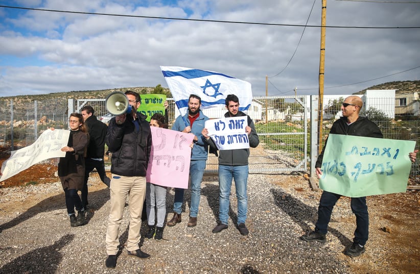 Protesters demonstrate at the entrance to Rehelim against Jewish youths from the nearby Pri Ha’aretz Yeshiva who are suspected in the killing of Aysha Rabi (inset) in October (photo credit: OFER MEIR/FLASH90)