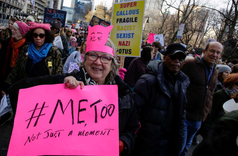 People take part in the Women's March in Manhattan in New York City, New York, U.S., January 20, 2018. (photo credit: REUTERS/EDUARDO MUNOZ)
