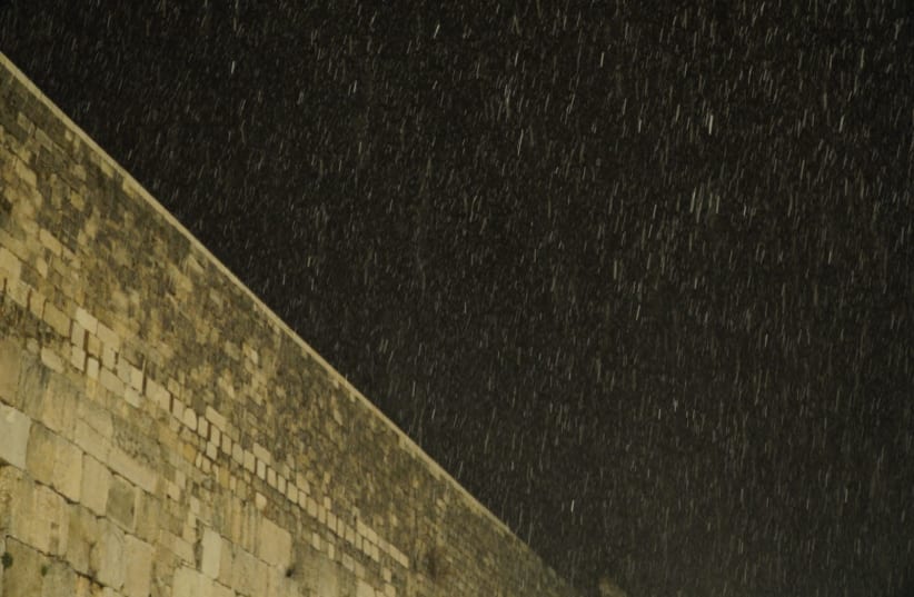 Snow falls above the Western Wall (photo credit: MARC ISRAEL SELLEM)