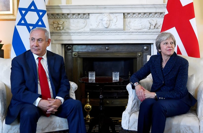 Britain's Prime Minister Theresa May welcomes Israel's Prime Minister Benjamin Netanyahu to Downing Street in London, June 6, 2018 (photo credit: TOBY MELVILLE/REUTERS)
