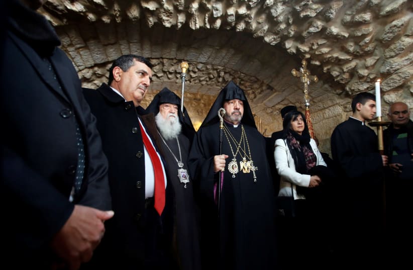 Armenian Patriarch of Jerusalem Nourhan Manougian arrives to lead a mass at the Church of the Nativity in Bethlehem January 18, 2019. (photo credit: MUSSA QAWASMA / REUTERS)