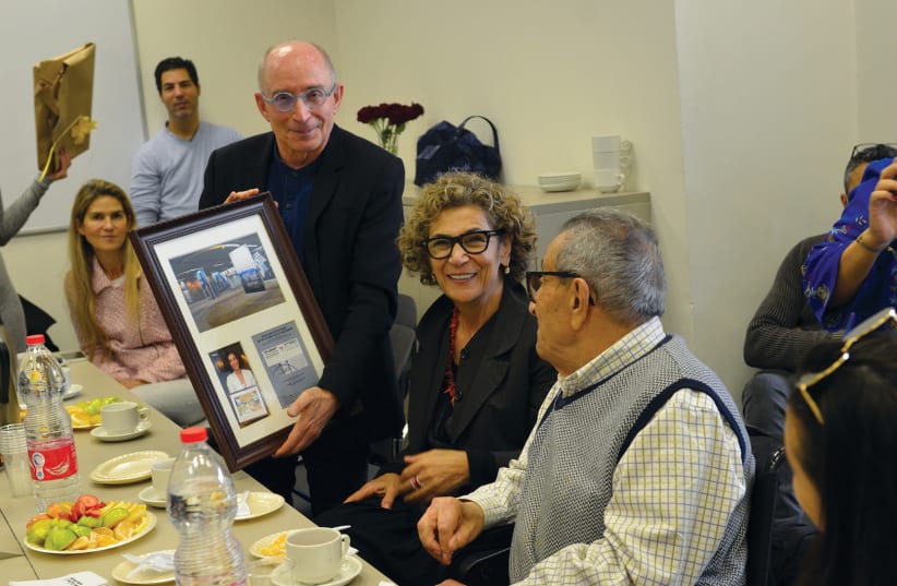 UNIVERSITY OF HAIFA president Prof. Ron Robin honors Younes and Soraya Nazarian with a plaque commemorating the family’s contributions to the University (photo credit: UNIVERSITY OF HAIFA)