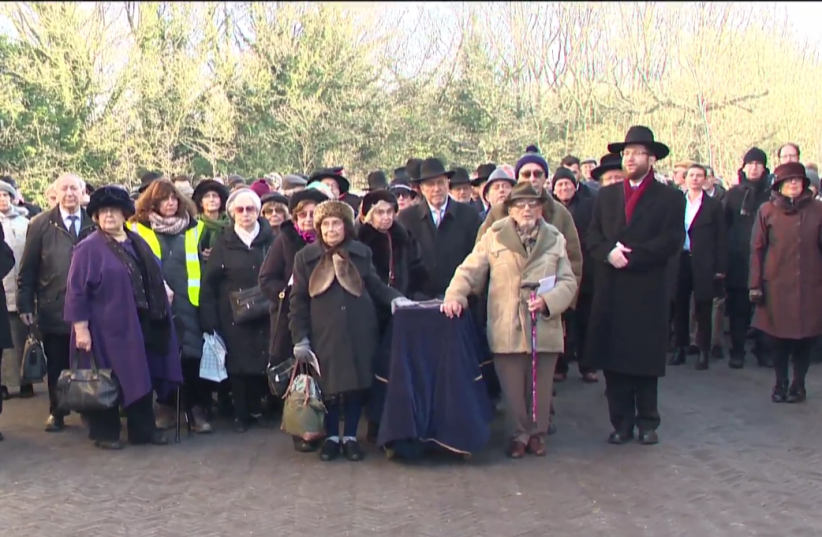 HOLOCAUST SURVIVORS accompany a coffin containing the remains of six Holocaust victims to its burial on Sunday in Bushey, UK (photo credit: screenshot)