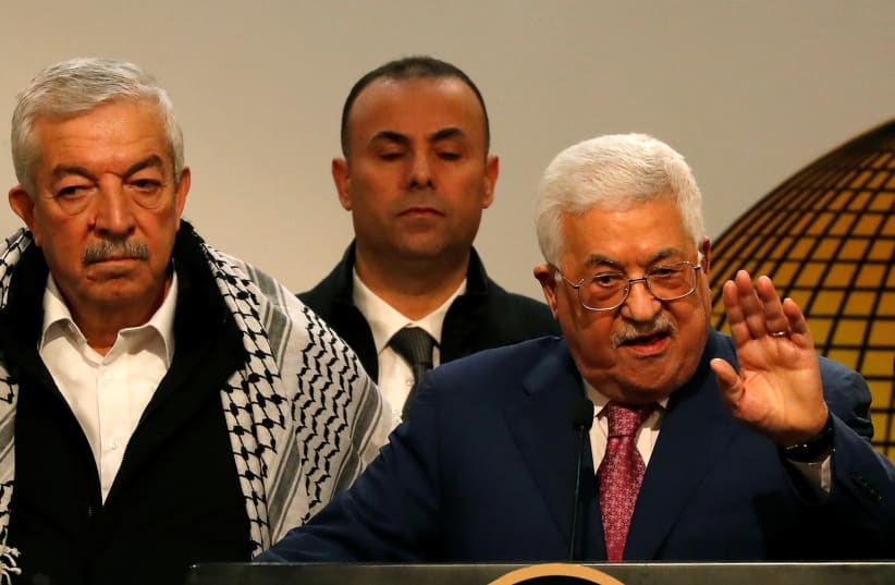 Palestinian President Mahmoud Abbas gestures as he speaks during a ceremony marking the 54th anniversary of Fatah's founding, in Ramallah, December 31, 2018 (photo credit: MOHAMAD TOROKMAN/REUTERS)