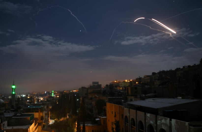 Syrian air defence batteries responding to what the Syrian state media said were Israeli missiles targeting Damascus, in a picture taken early on January 21st, 2019 (photo credit: STR / AFP)