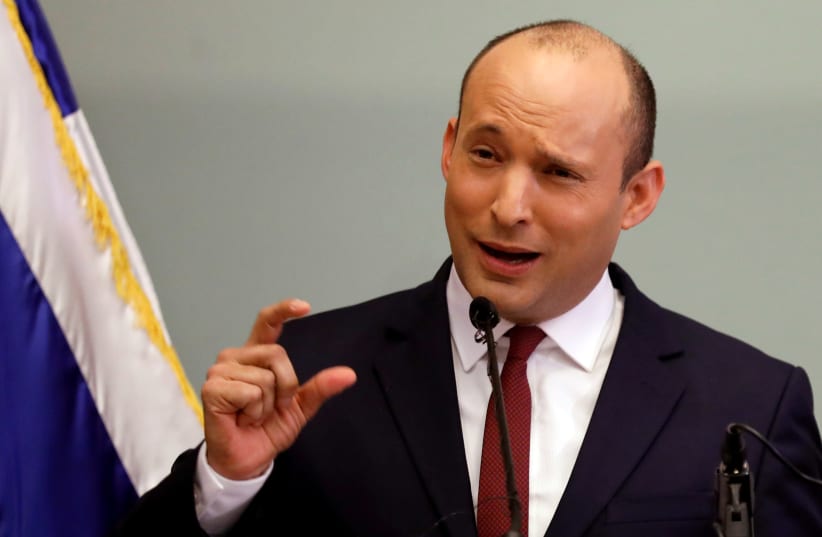 Education Minister Naftali Bennett delivers a statement to members of the media at the Knesset, Jerusalem, 2018. (photo credit: AMIR COHEN/REUTERS)