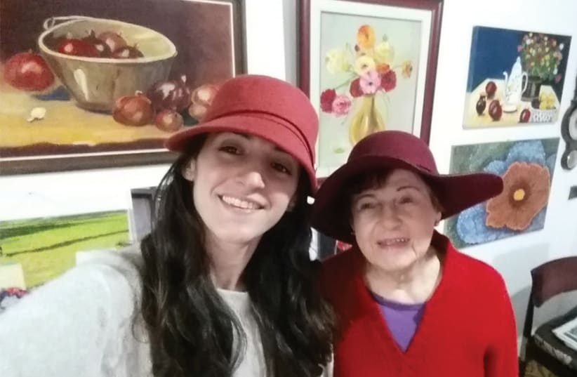 ANABELLE YAAKOV, 26, visits with Malka Liberman, 92, in her home in Beersheba. (photo credit: Courtesy)