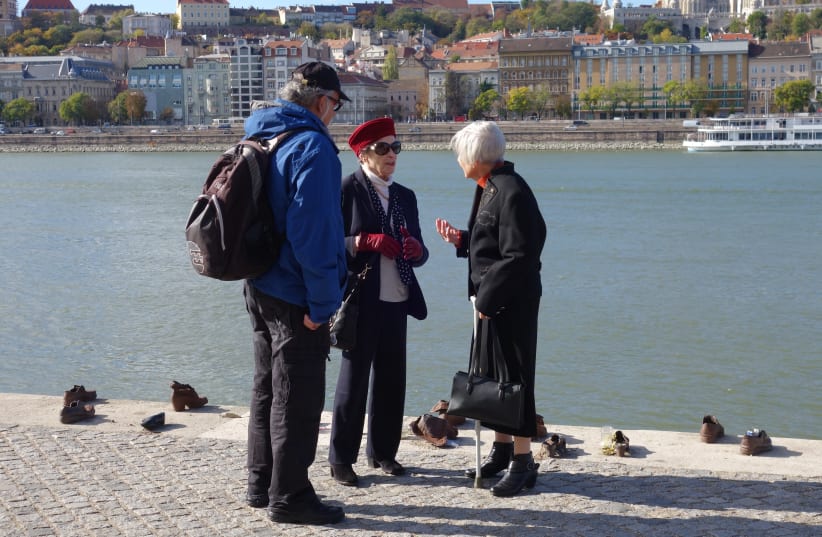 IDEON HARTMAN (left), Anki Tauber (center) and Vera Rudnai stand near the Holocaust memorial by the Danube River in Budapest, commemorating the murder of Hungarian Jews shot and thrown into the river by the Cross Arrow fascists. Tauber and Rudnai fled to Budapest from Amsterdam in 1943 (photo credit: WILLY LINDWER)