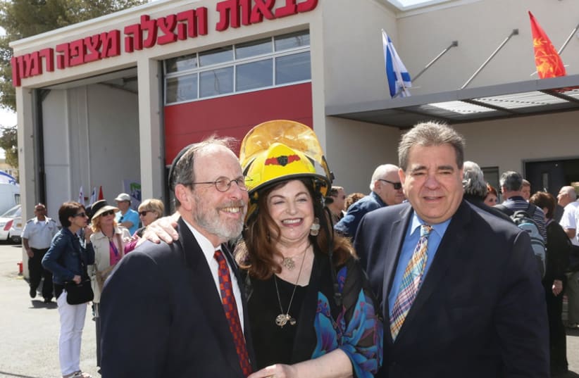 STEPHEN AND PENNY ROSEN with JNF-USA CEO Russell F. Robinson at Mitzpe Ramon’s new fire station dedication in 2016 (photo credit: JNF)