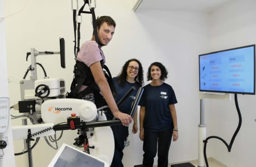 IDF combat soldier Dvir Teitelbaum uses Hadassah Hospital's new Lokomat robotic walking system (photo credit: AVI HAYUN)