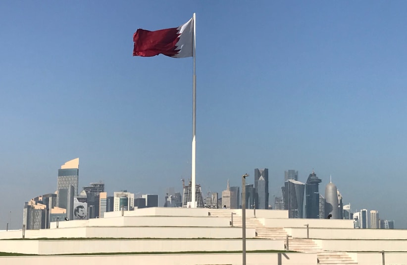 The Qatari flag is seen at a park near Doha Corniche, in Doha (photo credit: REUTERS/IBRAHEEM AL OMARI)