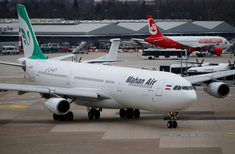 FILE PHOTO: An Airbus A340-300 of Iranian airline Mahan Air taxis at Duesseldorf airport, Germany, January 16, 2019. (photo credit: WOLFGANG RATTAY / REUTERS)