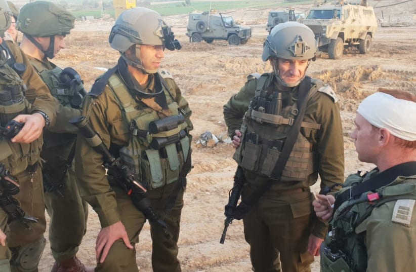 Head of IDF Southern Command, Maj.-Gen. Hertzi Halevy, meets an officer who was shot in the helmet by a Gazan sniper. (photo credit: IDF SPOKESPERSON'S UNIT)