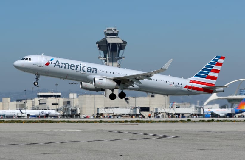An American Airlines Airbus A321-200 plane takes off from Los Angeles International airport (LAX) in Los Angeles, California, U.S. March 28, 2018 (photo credit: REUTERS/MIKE BLAKE)
