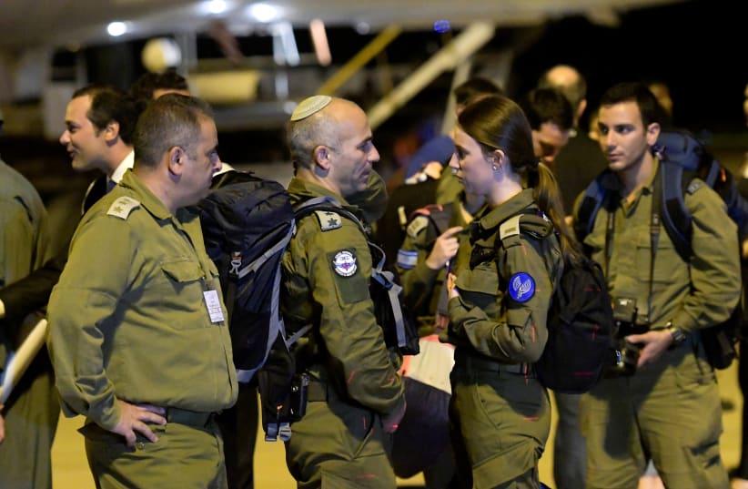 Israeli military personnel arrive to help search for victims of a collapsed tailings dam owned by Brazilian mining company Vale SA, at Confins airport in Belo Horizonte, Brazil January 27, 2019 (photo credit: WASHINGTON ALVES / REUTERS)