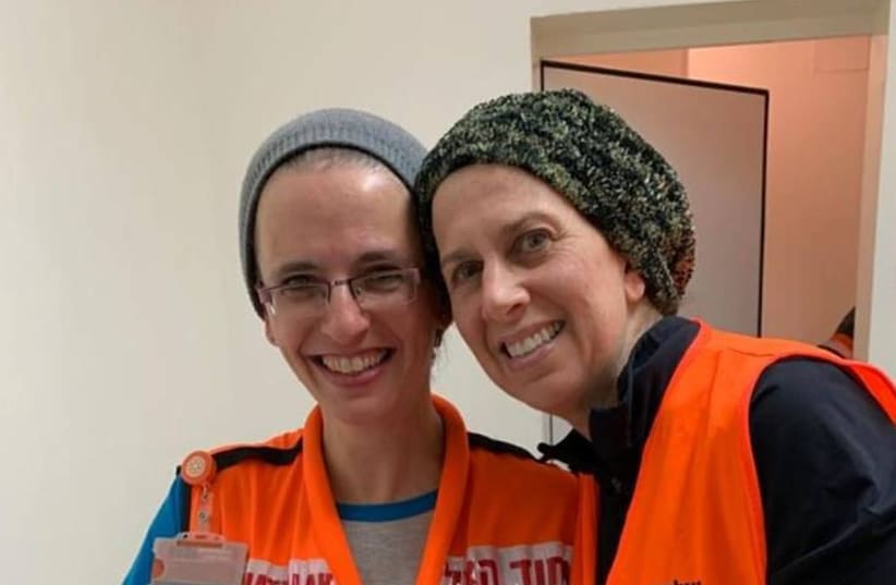 Allison Rosenbaum and Ruthie Printz of the United Hatzalah Midwives Unit with a newborn baby in Beit Shemesh, January 27, 2019 (photo credit: UNITED HATZALAH‏)