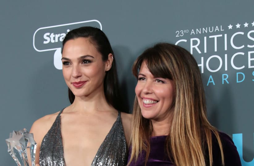 23rd Critics' Choice Awards – Photo Room – Santa Monica, California, U.S., 11/01/2018 – Gal Gadot (L) and Patty Jenkins pose with their award for Best Action Movie for "Wonder Woman" (photo credit: MONICA ALMEIDA/REUTERS)