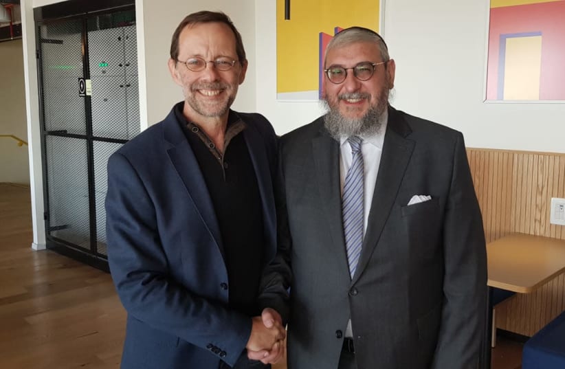 Moshe Feiglin [L] shakes hands with Rabbi Haim Amsalem [R].  (photo credit: Lahav Harkov)