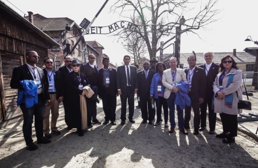 UN diplomats in the Auschwitz museum in Poland, at the center, Israeli ambassador to the UN Danny Danon 2018 (photo credit: Courtesy)