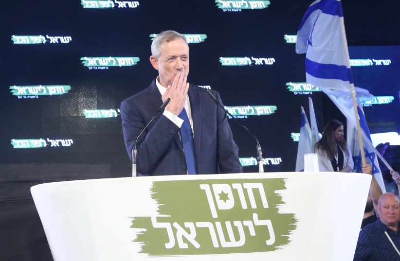Benny Gantz, chairman of the Israel Resilience Party, blows a kiss to the crowd at an event launching his campaign, January 29th, 2019 (photo credit: MARC ISRAEL SELLEM/THE JERUSALEM POST)