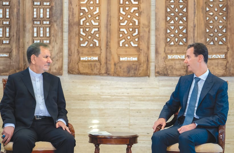 IRANIAN VICE President Eshaq Jahangiri meets with Syria’s President Bashar Assad in Damascus this week.  (photo credit: SANA/REUTERS)