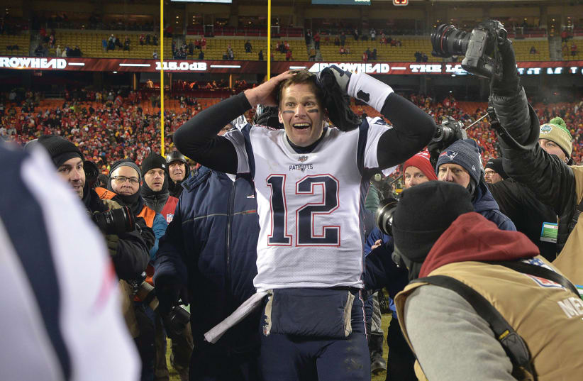 NEW ENGLAND PATRIOTS quarterback Tom Brady reacts after defeating the Kansas City Chiefs during overtime in the AFC Championship game at Arrowhead Stadium.  (photo credit: JAY BIGGERSTAFF-USA TODAY SPORTS)