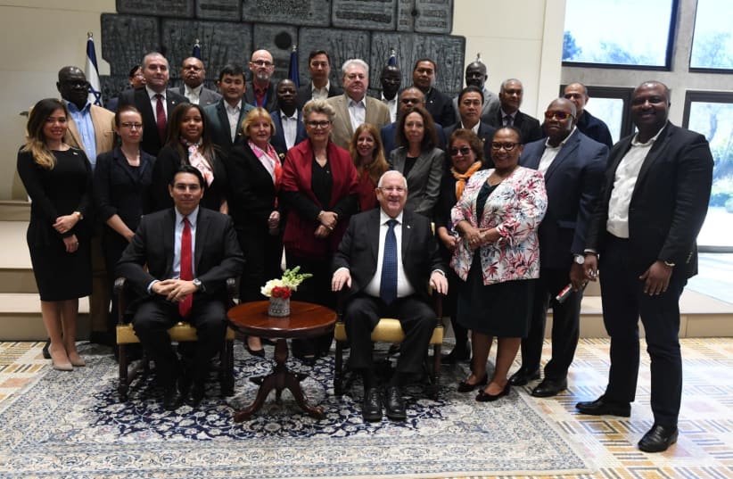 President Reuven Rivlin (front, right) and Ambassador to the U.N. Danny Danon (front, left) pose with visiting U.N. representatives, February 3rd, 2019 (photo credit: Mark Neiman/GPO)
