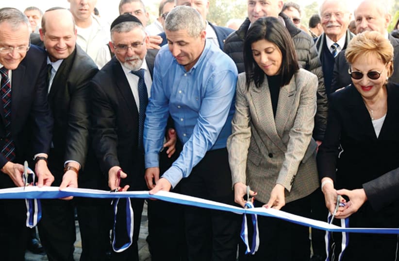 CUTTING THE ribbon at the Bar-Ilan University Research Institute in the Galilee Medical Center in Nahariya.  (photo credit: Courtesy)