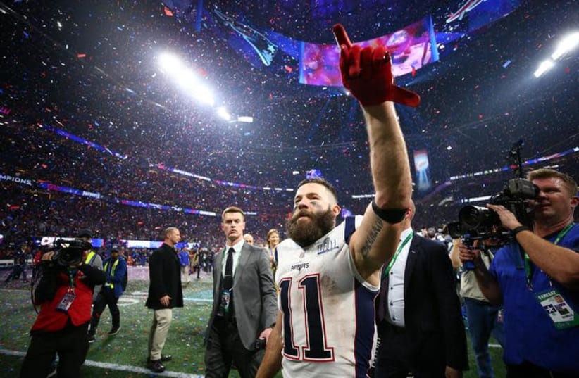 New England Patriots wide receiver Julian Edelman (11) celebrates on the field after defeating the Los Angeles Rams in Super Bowl LIII at Mercedes-Benz Stadium (photo credit: REUTERS)