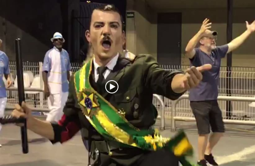 A Samba dancer in Brazil in a mock-outfit claiming  Brazilian President Jair Bolsonaro is like Adolf Hitler  (photo credit: screenshot)