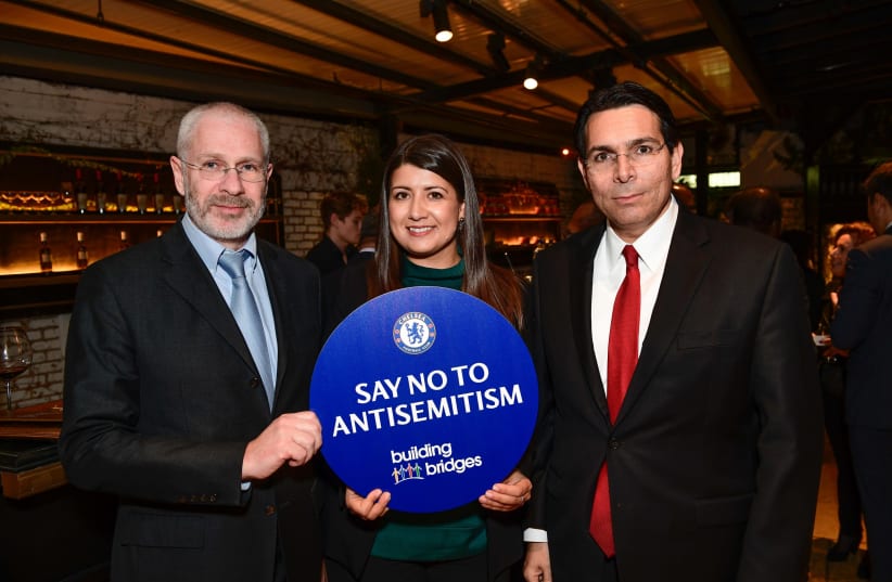 Israeli ambassador to the UN Danny Danon, Chelsea FC Director Eugene Tenenbaum and Rola Brentlin, Chelsea FC’s Say No to Antisemitism Campaign, 2019. (photo credit: SHAHAR AZRAN / WJC)