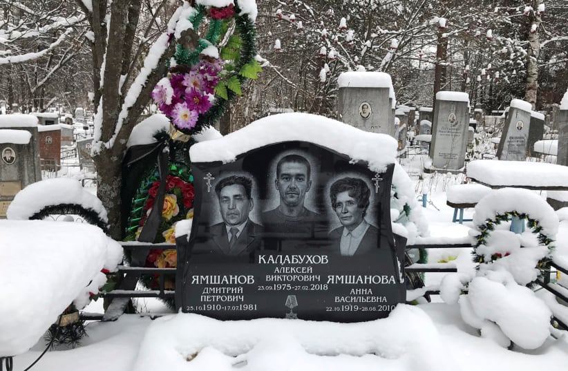The name of Russian private military contractor Alexei Kalabukhov (C), killed in Syria, is seen at a gravestone at a cemetery in Kirov, Russia November 27, 2018. (photo credit: MARIA TSVETKOVA/REUTERS)