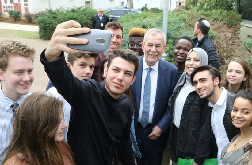 Australian President Alexander Van der Bellen poses for a selfie with students from the Givat Haviva Internationa School. (photo credit: Courtesy)