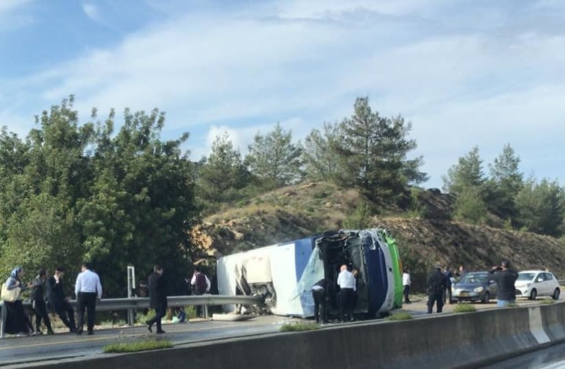 The overturned bus, February 10th, 2019 (photo credit: Courtesy)