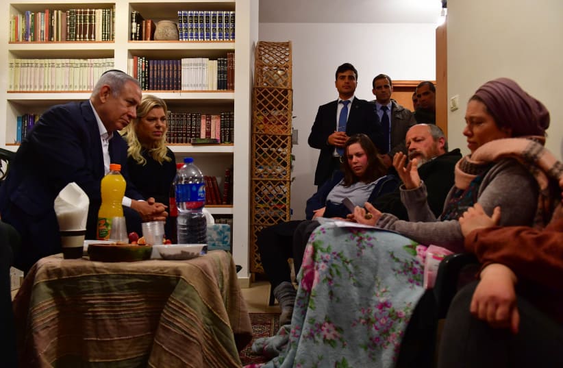 Prime Minister Benjamin Netanyahu and Sarah Netanyahu visit the Ansbacher family on February 10, 2019 (photo credit: GPO)